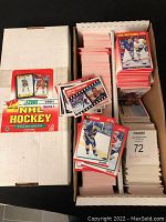 Open white box showing multiple stacks of 1991 Score hockey cards in excellent condition.