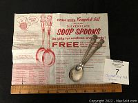 Two silverplate advertising soup spoons and Campbell Kid order form, showing bracelet size comparison and spoon detail