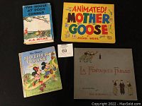 Overview of four books displayed on dark background