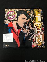 Front cover of Elvis Presley 40 Greatest Hits colored pink pressing LP set with artwork and 40 greatest badge.