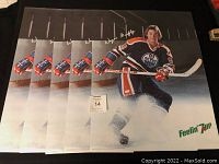 Five Wayne Gretzky 7Up promotional hockey posters stacked together showing the front image of Gretzky skating.