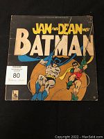 Front album cover of Jan and Dean Meet Batman featuring Batman and Robin illustration.