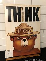 Front view of the Smokey the Bear poster showing the design and title 'THINK' with burnt matchstick and Smokey wearing ranger hat.
