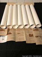 Seven rolled prints with a descriptive newspaper-style sheet outlining 'The Vanishing Buildings of Rural Canada' series.
