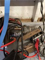 Badland 2500 lb ATV winch with wiring and mounting brackets visible