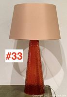 Full frontal view of lamp showing overall shape, shade, and base.