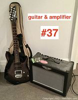 Ibanez guitar, gig bag, and Peavey amplifier shown together on floor