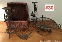 Overview of all items on a wooden surface showing the baskets and candleholders.