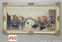 Full front view of the painting in its ornate decorative frame, showing the entire Venetian canal scene with gondolas and buildings.
