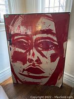 Full front view of the mounted artwork leaning against a wall under window light.