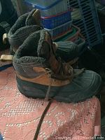 Side view of Timberland men's boots showing lace-up design and padded collar