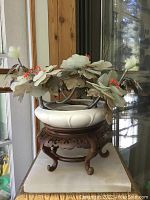 Front view of the entire arrangement showing porcelain bowl, carved wood stand and hardstone flowers