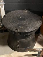 Top view showing concentric engraved patterns on drum surface and decorative protrusions