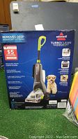 Box front showing Bissell Turboclean vacuum, features and pet image.