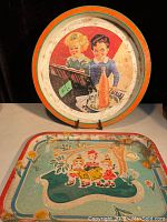 Full view of round Seven-Up Crush tray with children playing music and a bottle illustration, showing age wear.