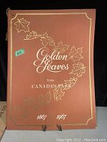 Front cover of the pamphlet titled 'Golden Leaves from Canada's Past 1867-1967' with gold maple leaf designs on brown background