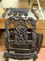 Overall view of disassembled chair parts laid out on workbench