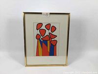 Full view of framed lithograph showing abstract color shapes with red, blue, yellow, and black outlines