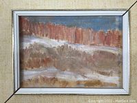 Close-up view of the framed abstract landscape oil painting showing brush strokes and color composition.