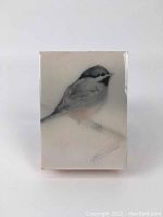 Full frontal photo of resin print over wood art featuring a bird, showing the entire piece including the artist's signature.