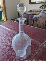 Full view of decanter with stopper upright on table