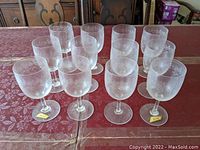 All twelve goblets arranged on table surface
