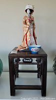 Overall group shot: blackwood table with geisha figurine and blue floral bowl
