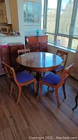 View showing round table and four chairs in room