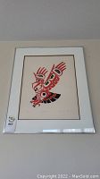 Full view of framed owl print with lot sticker attached