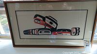Full view of the framed print showing image, mat, and frame.