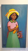 Full view of signed painting on wood showing young girl in bright clothing and background