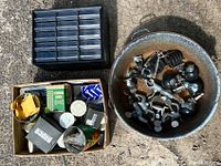 Overview of assorted workshop supplies including the plastic divider kit, metal container with castors, and boxes of screws etc.
