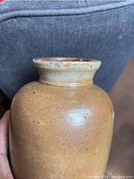 Close-up of crock neck and rim, displaying glaze and slight distortion at the top rim.