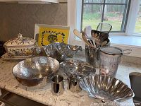 Photo showing full lot on kitchen counter including tureen, serving bowls, utensil holder, pitcher and tray.