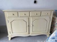 Full front view of Nichols & Stone distressed sideboard showing four drawers and two cabinet doors.