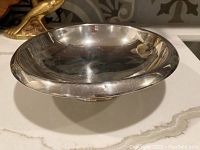 Front view of large sterling silver pedestal bowl showing overall shape and finish