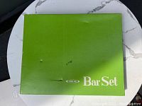 Green original box labeled 'Ideal Bar Set' with some signs of wear