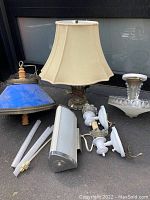 Overview of vintage lighting lot with table lamp, pendant lamp, sconces, ceiling fixture, and fluorescent bulbs.