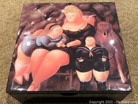 Top view of lacquer box showing reproduction artwork on lid featuring a stylized family with mother, children, and a rabbit in dark warm tones.