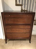 Front view of walnut high chest showing overall condition and design