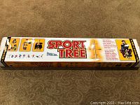 Photo of the original packaging box of the Sport Tree metal sports equipment drying stand showing branding and usage illustrations.