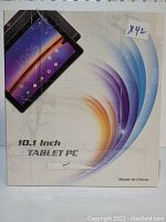 Photo of the boxed 10.1 inch Tablet PC showing the front of the packaging with device image and branding details.