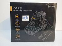 Box of AstroAI 100PSI Portable Air Compressor showing product features including smart tire inflator, metal motor, LCD digital display and LED flashlight