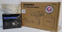 Boxed Workpro pink 12V cordless drill driver kit alongside a black box containing the high-powered headlamp