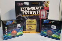 Front view of boxed Squad Hero Combat Arena Battle Obstacles set with two boxed Red Flying Balls labeled X20 each.