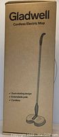 Photo of sealed retail box for a Gladwell cordless electric mop. Box lists features: dual rotating design, extendable pole, cordless.