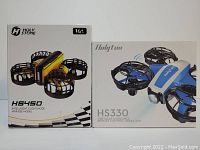 Photo showing boxed Holy Stone HS450 and Holytom HS330 mini drones, highlighting packaging and model details.