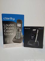 Box of Easyfone Prime A1 flip phone with charger, showing branding and phone image