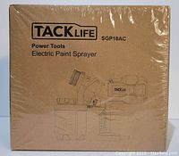 Sealed cardboard box packaging of the Tacklife SGP18AC electric paint sprayer, showing product illustration and branding.