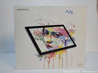Front view of Veidoo 10.1 inch tablet PC box showing image of the tablet and colorful artistic illustration on the screen area.